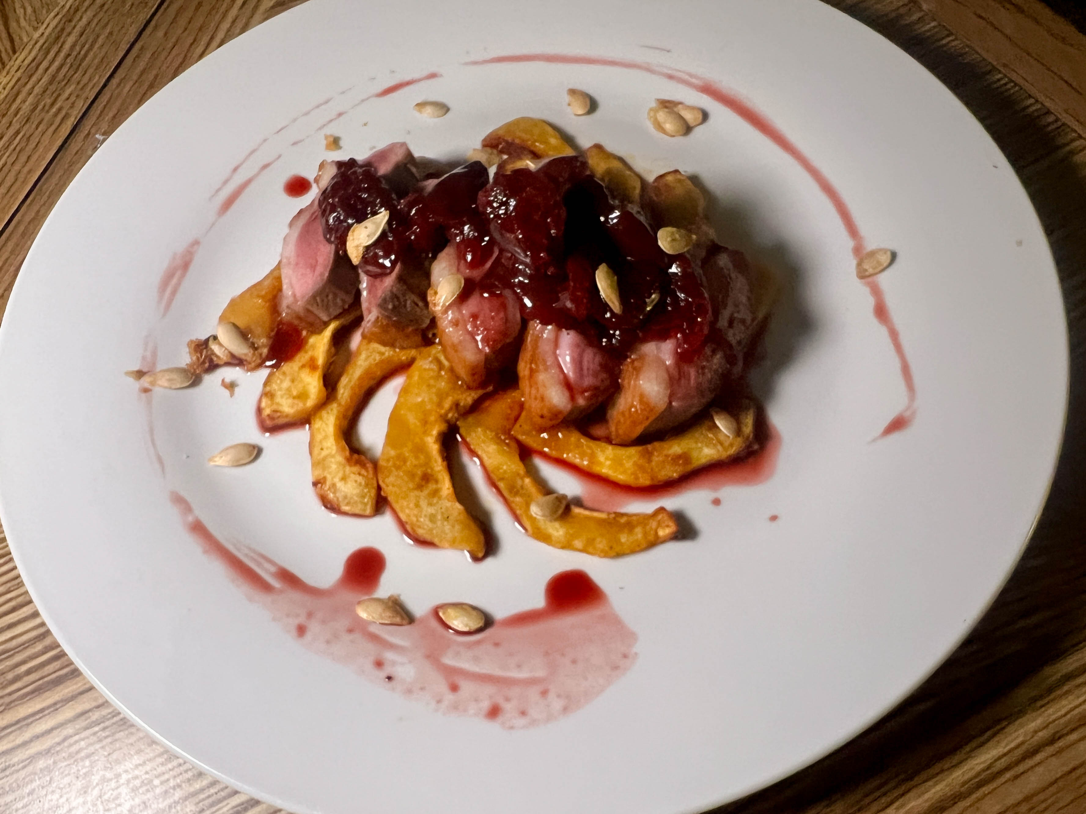Pan seared duck, with braised cherries and roasted acorn squash